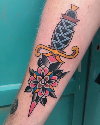 Traditional dagger tattoo by Andrea Daniel. La Flor Sagrada, Melbourne 