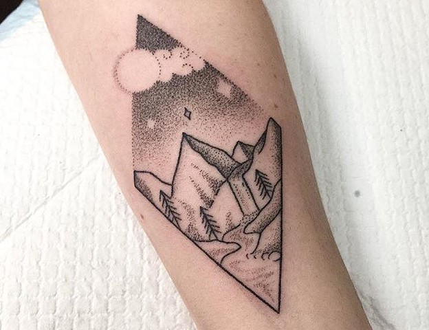 Black ink tattooing with Stippling and line work. Sweet little landscape tattoo of a mountain range including river and cypress trees. Amy Jones at La Flor Sagrada Tattoo in Melbourne. Black ink tattooing in professional happy and safe environment. 