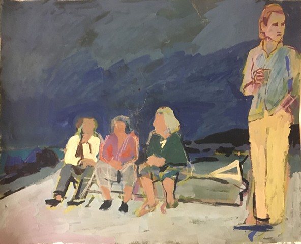 Three seated and one standing figure on a beach at night.
