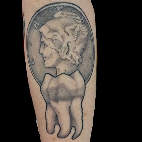 This tattoo is a black and grey piece of a molar tooth and a mercury dime.