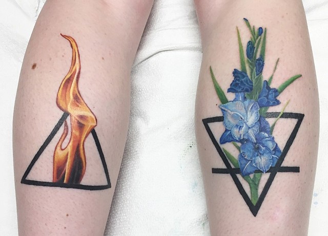 Flame and gladiolus with alchemical symbols for earth and fire