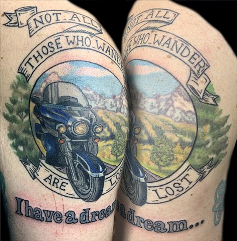 Motorcycle and scenery with scroll and lettering