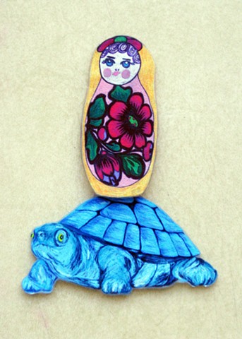 Matryoshka doll hitching a ride on a blue turtle Shrinky-Dink my Holly Campbell