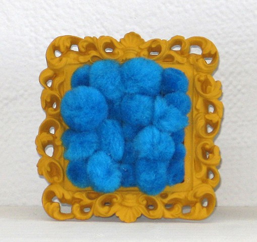found picture frame sculptures painted filled with turquoise gold pom poms by Holly Campbell