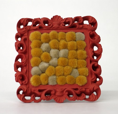 sculpture found picture frames painted salmon color with gold tan pom poms by Holly Campbell