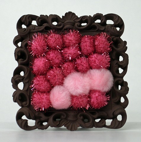 sculpture found picture frame painted brown with shiny pink pom poms by Holly Campbell