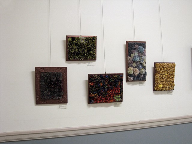 sculpture installation old redmond school house brown glittered picture frames and multicolored yarn pom poms by Holly Campbell