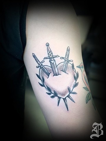 Heart and swords tattoo
