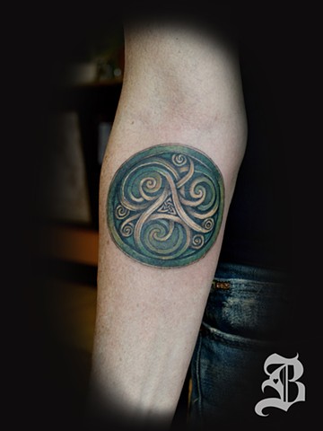 Celtic triskelion tattoo