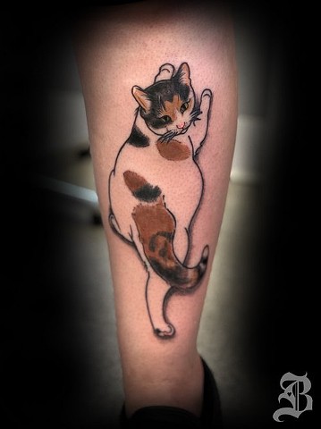 Climbing cat tattoo