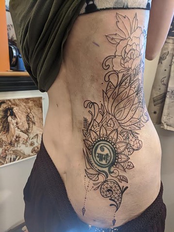 Abstract floral geometric tattoo