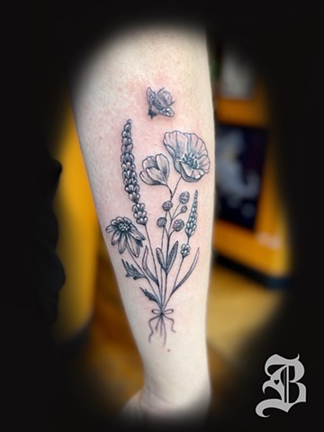 Dainty flower bouquet tattoo