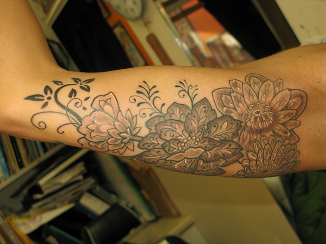 Black and grey floral tattoo 