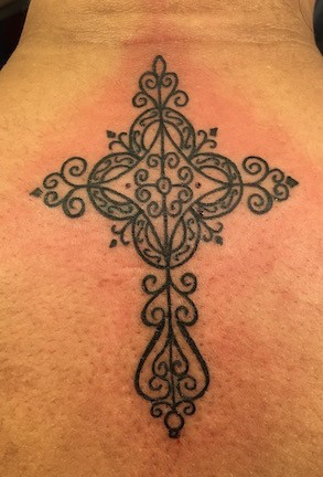 Decorative cross tattoo