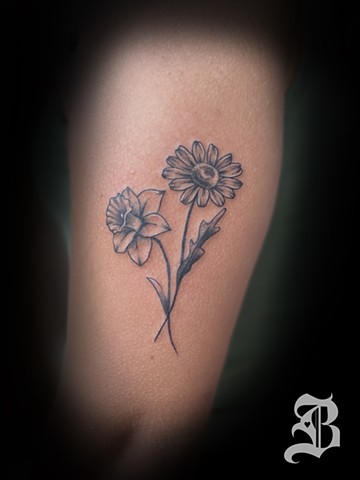 Daisy and daffodil tattoo