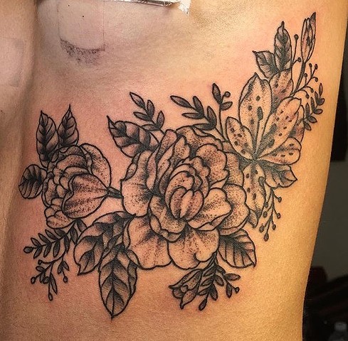 Black and grey flowers tattoo