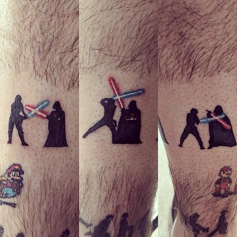 Star Wars light saber fight tattoo