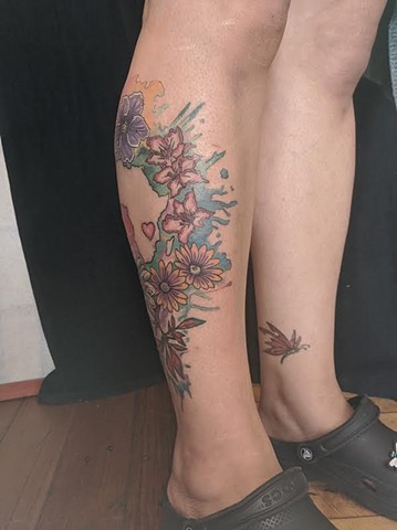 Floral watercolor tattoo