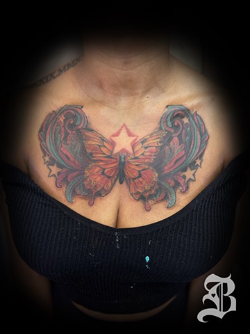 Butterfly chest cover up tattoo