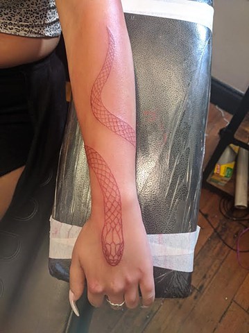 Red line snake tattoo