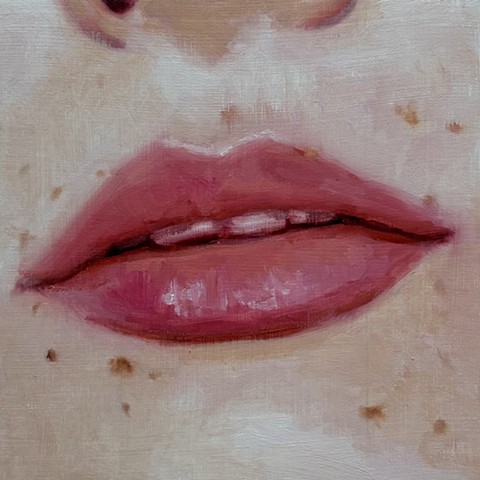 Small lips, freckles