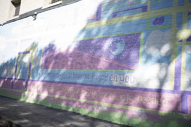 detail of mural in dappled sunlight