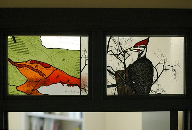 Transom detail, pileated woodpecker and map of esker formation at Bickford Pond in Porter, ME