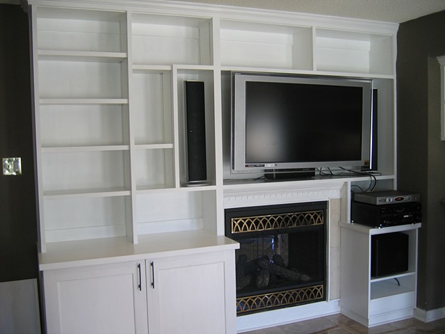 Entertainment center designed for a Katrina-recovered home in New Orleans East. Special care had to be taken to surround the fireplace.