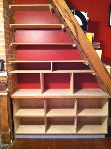 Cypress cabinet under stairs before doors were installed