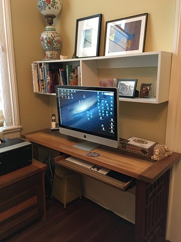 Desk made of sinker cypress with end panel
made from restored vintage window frame