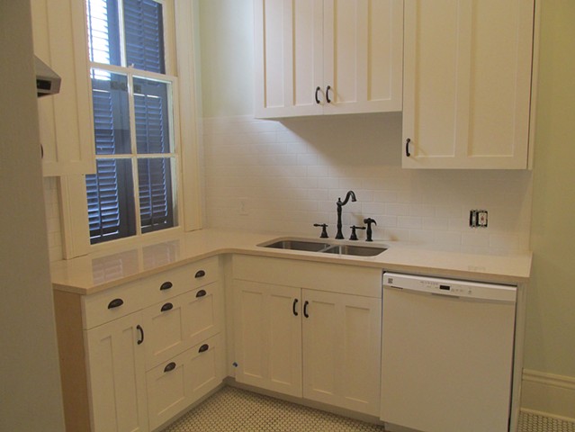 Kitchen with white cabinets for historic New Orleans home