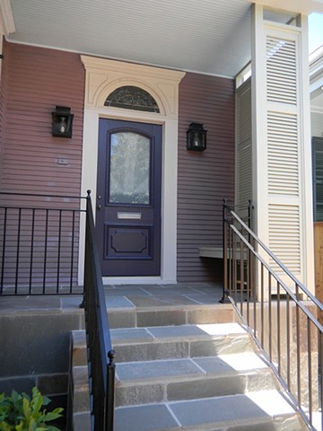 Custom-made porch shutters for uptown New Orleans home, to provide privacy and ventilation. Designed by architect, Michael Nius