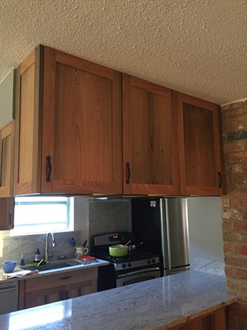 Living room side with peninsula and upper cabinets