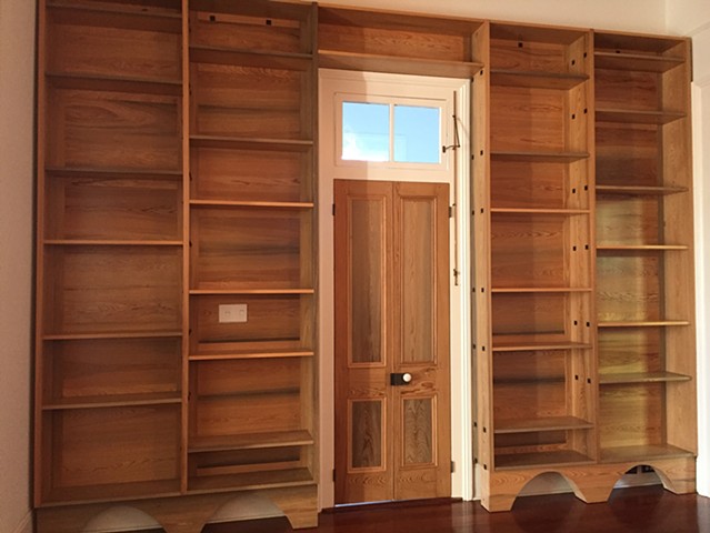 This library door began as a traditional 34" single door with a glass pane above two wood panels. I made it into a pair of French doors.