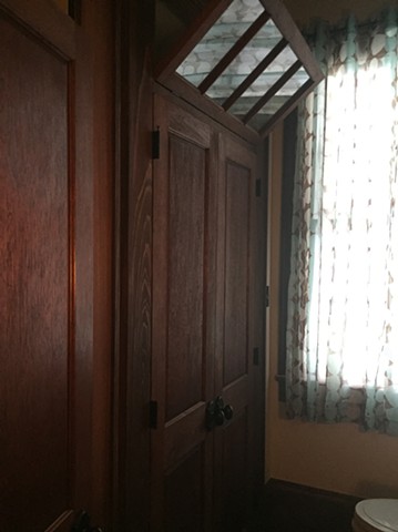 Spanish cedar closet door with transom