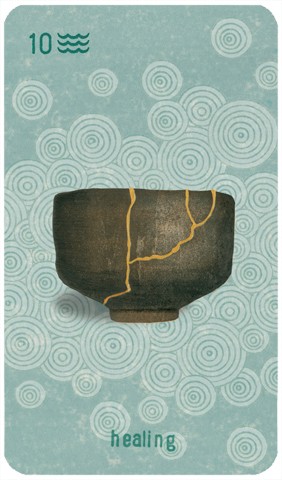 Ten of Cups: an image of a cup repaired using the Japanese method of kintsugi