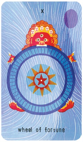 The Wheel of Fortune Tarot card: woodblock print of the Buddhist god of impermanence Yama holding a wheel with a star in the middle