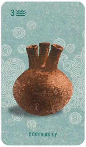 Three of Cups: a dark brown ceramic jug with three spouts