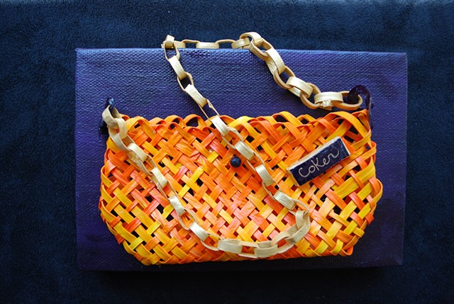 Whimsical orange handbag made from woven acrylic paint.