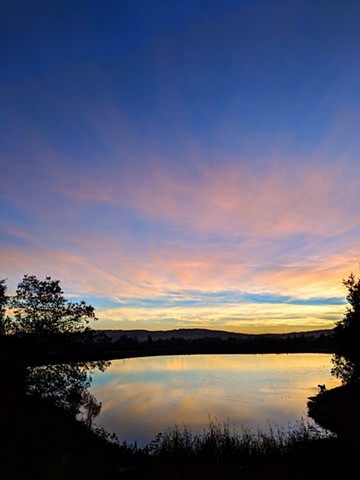 Clouds at Dusk reflected in a pond