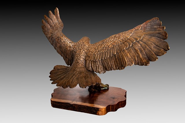 bronze sculpture of red tailed hawk