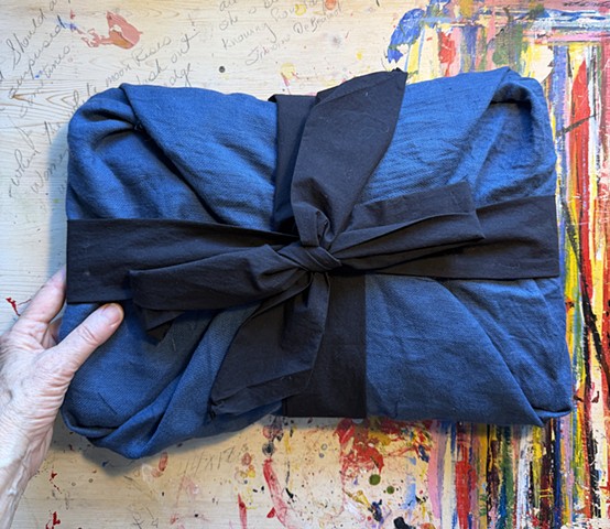book of grief wrapped and bundled