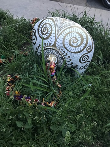 shrine in street planter