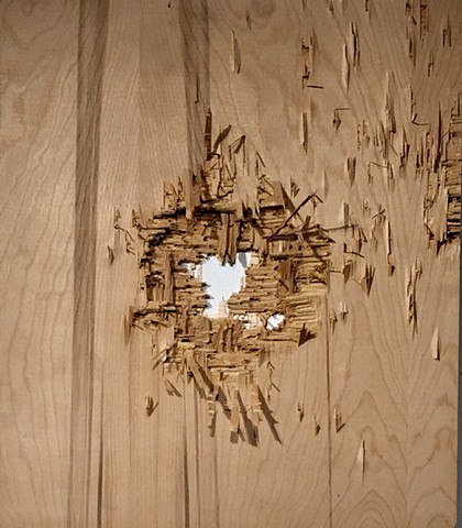 Plywood panel with ballistic damage