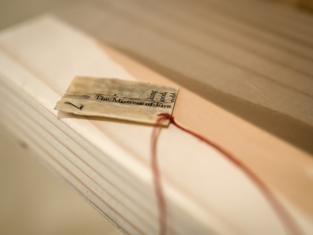 detail of text coated in beeswax