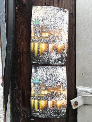 decayed poster on telephone post
