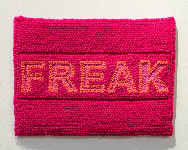 Terri Whetstone Rughooking the word Freak in pink wool 