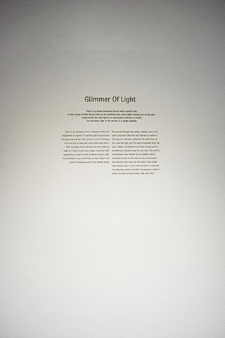 Glimmer of Light is a story engraved into the gallery wall. The story is of an insulation done a month prior to the show.