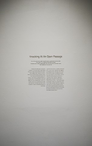 Knocking At An Open Passage is a story engraved into the gallery wall. The story is of an insulation done a month prior to the show.