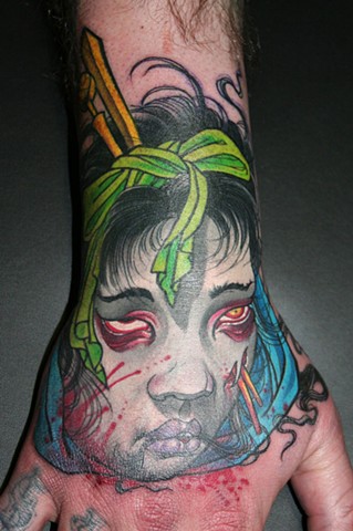 severed geisha head hand